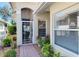Entryway with tiled floors, glass front door, and window at 1022 Yosemite Dr, Englewood, FL 34223