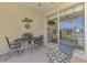 Covered lanai with comfortable seating, ideal for relaxing or entertaining guests at 1022 Yosemite Dr, Englewood, FL 34223