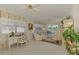 Cozy living room with a view of the lake and a white decorative desk and decor at 1022 Yosemite Dr, Englewood, FL 34223