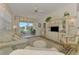 Bright and airy living room with water view and decorative built-in shelving unit at 1022 Yosemite Dr, Englewood, FL 34223