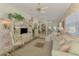 Light-filled living room with water view, comfortable seating, and a decorative shelving unit at 1022 Yosemite Dr, Englewood, FL 34223