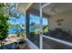 Enjoy water views from the screened porch, a tranquil retreat by the lake at 1022 Yosemite Dr, Englewood, FL 34223