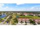 Stunning aerial view showcasing the community's layout, lush landscaping, and serene water features at 1050 Jonah Dr, North Port, FL 34289
