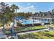 Aerial view of community amenities including a pool, playground, bocce ball, and gathering place at 1050 Jonah Dr, North Port, FL 34289