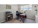Functional office space with a comfortable chair, computer setup, and a bright window view at 1050 Jonah Dr, North Port, FL 34289