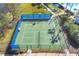 Aerial view of a fenced sports area featuring a pickleball court at 1050 Jonah Dr, North Port, FL 34289