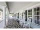 Inviting porch with rocking chairs offering a relaxing space at 1050 Jonah Dr, North Port, FL 34289