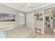 Cozy bedroom with a large window, closet, coastal decor, and a ceiling fan at 1088 Bluffwood Dr, Nokomis, FL 34275