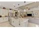 An inviting open-plan kitchen with a large island and modern stainless steel appliances at 1088 Bluffwood Dr, Nokomis, FL 34275
