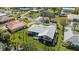 Aerial view showcases this property's well-manicured lawn and meticulous landscaping at 111 2Nd St, Nokomis, FL 34275