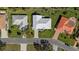 Top-down aerial view highlighting the home's roof, landscaping, and driveway at 111 2Nd St, Nokomis, FL 34275