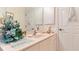 Bathroom with a vanity, sink, and cabinet storage with decor at 111 2Nd St, Nokomis, FL 34275