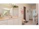 Bathroom with shower, decorated counter, ample vanity space, and tiled flooring at 111 2Nd St, Nokomis, FL 34275
