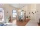 Elegant dining room featuring a glass table, chandelier, and ample natural light from a large window at 111 2Nd St, Nokomis, FL 34275