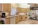 Well-lit kitchen with ample cabinet space, modern appliances, and a functional layout at 111 2Nd St, Nokomis, FL 34275
