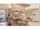 Spacious kitchen featuring an island with seating, neutral cabinets and modern appliances at 111 2Nd St, Nokomis, FL 34275