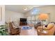 Inviting living room with comfortable seating, natural light, and vaulted ceilings at 111 2Nd St, Nokomis, FL 34275