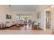 A bright and airy living room featuring a large window and stylish furnishings at 111 2Nd St, Nokomis, FL 34275