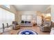 Bright living room with an open layout, comfortable furnishings, and views into the kitchen at 111 2Nd St, Nokomis, FL 34275