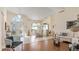 Inviting living room with high ceilings, large windows, and elegant furnishings and decor at 111 2Nd St, Nokomis, FL 34275