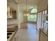Open concept kitchen and living room with hardwood floors and abundant natural light at 111 2Nd St, Nokomis, FL 34275