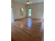 Spacious living room featuring hardwood floors, natural light, and an open layout at 111 2Nd St, Nokomis, FL 34275