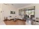 Spacious living room with a large window and comfortable seating area for relaxing or entertaining at 111 2Nd St, Nokomis, FL 34275