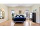 A spacious main bedroom has an eclectic decor and is decorated with personal touches throughout at 111 2Nd St, Nokomis, FL 34275