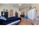 A modern main bedroom is decorated with black furniture and comfortable finishes, and has nice floors at 111 2Nd St, Nokomis, FL 34275