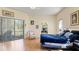A bright main bedroom has a large slider leading to a balcony or porch, and a comfortable sitting area at 111 2Nd St, Nokomis, FL 34275