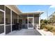 Screened in patio with concrete flooring and outdoor seating at 111 2Nd St, Nokomis, FL 34275