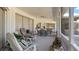 Spacious screened-in lanai with seating, plants and ceiling fan at 111 2Nd St, Nokomis, FL 34275