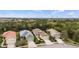 Birds eye view of the home featuring a yellow exterior, manicured landscaping, and tile roof at 11415 Fort Lauderdale Pl, Venice, FL 34293