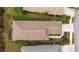 Aerial view of a meticulously maintained home with a brown tile roof and screened lanai at 11415 Fort Lauderdale Pl, Venice, FL 34293