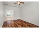 Bedroom with hard wood floors and bright, neutral paint and trim at 11415 Fort Lauderdale Pl, Venice, FL 34293