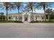 Inviting clubhouse featuring white columns, blue shutters, and a charming entrance at 11415 Fort Lauderdale Pl, Venice, FL 34293