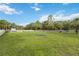 Large, fenced dog park with play equipment and green space at 11415 Fort Lauderdale Pl, Venice, FL 34293