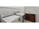 Well-lit laundry room featuring a washer, dryer, and utility sink with storage at 11415 Fort Lauderdale Pl, Venice, FL 34293