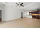 Open living area showcasing tile floors, abundant natural light, and a seamless transition to the kitchen at 11415 Fort Lauderdale Pl, Venice, FL 34293