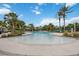 Community pool with a shallow entry, slide, and seating areas at 11415 Fort Lauderdale Pl, Venice, FL 34293