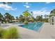 Beautiful pool area surrounded by lush landscaping and comfortable lounge chairs at 11415 Fort Lauderdale Pl, Venice, FL 34293