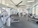 Spacious gym with high ceilings, a large ceiling fan, and modern exercise equipment at 11558 Renaissance Blvd, Venice, FL 34293