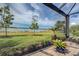 Enjoy serene water views from this screened-in lanai, complete with a paver patio and peaceful plants at 11558 Renaissance Blvd, Venice, FL 34293