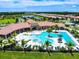 Aerial view of the community pool featuring a hot tub and lap pool at 11910 Alessandro Ln, Venice, FL 34293