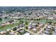 Wide aerial view showing a neighborhood with many homes surrounding winding waterways and ponds at 1220 Lakeside Dr, Venice, FL 34293