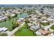 Expansive aerial view of a waterfront community featuring homes nestled along canals and lakes in a picturesque setting at 1220 Lakeside Dr, Venice, FL 34293