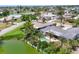 An aerial view of a waterfront community with mature trees and well-maintained lawns at 1220 Lakeside Dr, Venice, FL 34293