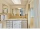 Functional bathroom with a sink, vanity, mirror and shower, providing ample space at 1220 Lakeside Dr, Venice, FL 34293