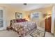 Comfortable bedroom with neutral walls, warm lighting, and cozy textiles at 1220 Lakeside Dr, Venice, FL 34293