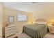Sunny bedroom featuring neutral walls, cozy textiles, and ample space at 1220 Lakeside Dr, Venice, FL 34293